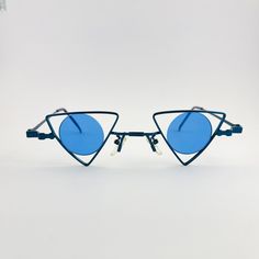 Authentic 1990s made vintage high quality frames paired with polyurethane lenses. One of a kind, rare discontinued frames with limited quantity. Shape: Triangle Lens color: blue Condition: New Deadstock Lens: UV 400 High Quality Durable Triangle Glasses, Triangle Sunglasses, Blue Lens, Blue Lenses, True Vintage, Eyewear Sunglasses, Vintage Y2k, Sunglasses Accessories, Mirrored Sunglasses