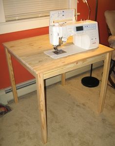 a sewing machine sitting on top of a wooden table