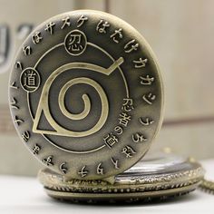 an antique pocket watch with chinese writing on it