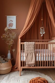 a baby's room with a crib, rug and pictures on the wall