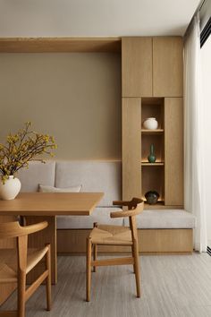 a wooden table sitting next to a white couch