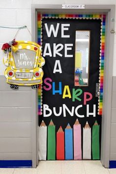 a classroom door decorated with colorful pencils and the words we are a slapp bunch