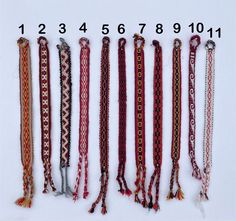 a number of different types of ties on a white surface with numbers in the background