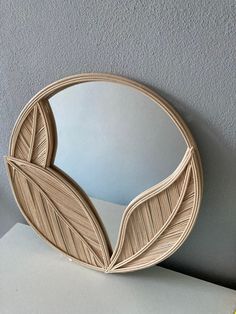 a mirror that is sitting on top of a table