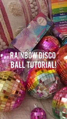 rainbow disco ball ornaments on a bed with text overlay reading rainbow disco ball tutorial