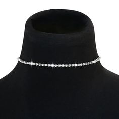 Elevate your style with our Diamond Stud Silver Choker! This slim rhinestone necklace adds a touch of edgy elegance to any outfit. Command attention and embrace the thrill of taking risks. Dare to stand out and shine like a diamond in this daring choker! Crystal Clavicle Chain Choker For Party, Party Crystal Choker With Clavicle Chain, Metal Choker For Night Out, Silver Choker For Night Out, Trendy Rhinestone Necklace For Party With Adjustable Chain, Trendy Choker Necklace For Night Out, Elegant Choker Necklace For Night Out, Trendy Choker For Night Out, Metal Rhinestone Choker Necklace