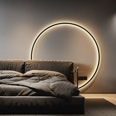 a bedroom with a circular light on the wall and bed in the foreground,