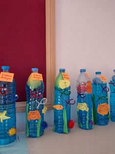 there are many plastic bottles with writing on them