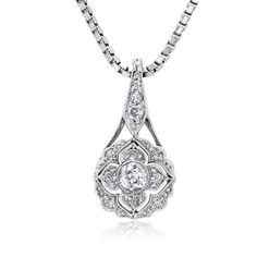 This is part of Chairish’s Fine Jewelry assortment.  Introducing the exquisite Art Deco Floral Diamond Pendant Necklace—a true embodiment of timeless elegance and sophistication. Crafted with meticulous attention to detail, this captivating piece showcases a dazzling 0.55 carat diamond set in a lustrous 18-karat white gold setting. The pendant's design draws inspiration from the Art Deco era, characterized by its geometric patterns and intricate motifs. The centerpiece of this necklace features a brilliant round-cut old European diamond, meticulously chosen for its exceptional clarity and radiance. The diamond's facets are expertly cut to maximize its brilliance, reflecting light from every angle and creating a mesmerizing play of sparkle. One Old European center diamonds weighing 0.20 car Exquisite Platinum Necklace With Single Cut Diamonds, Exquisite Diamond Necklace With Intricate Design, Elegant Diamond Necklace With Intricate Pendant Design, Diamond Pendant Necklace With Intricate Design, Timeless Cubic Zirconia Bridal Necklace With Diamond Cut, Elegant Oval Necklace With Diamond Accents, Timeless Bridal Necklace With Cubic Zirconia, Elegant Oval Necklaces With Diamond Accents, Classic Diamond Cut Platinum Bridal Necklace