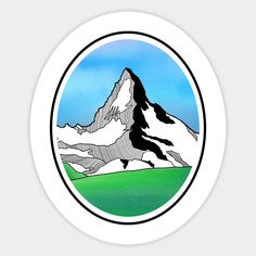 a round sticker with a mountain in the middle and green grass below it on a white background