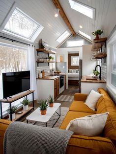 a living room filled with furniture and a flat screen tv