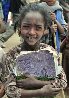 The children that are fortunate enough to go to school learn English at an early age .. Edward Weston, World Cultures, Photojournalism