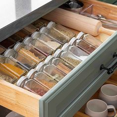 the drawers are filled with spices and other items