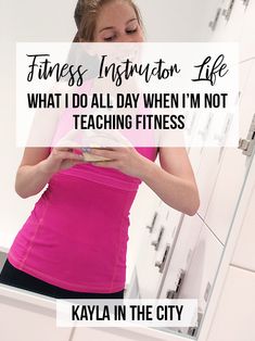 a woman is looking at her cell phone in the mirror with text that reads, fitness instruction life what i do all day when i'm not teaching fitness kayla in the city