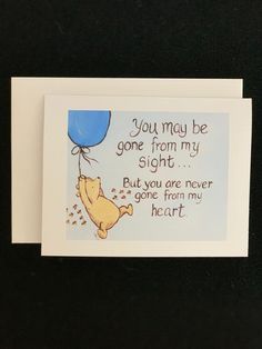 a winnie the pooh birthday card with an image of a balloon floating above it