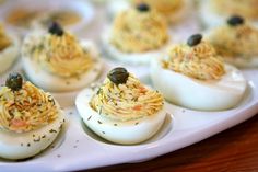 deviled eggs stuffed with various types of food