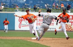 the baseball players are running on the field