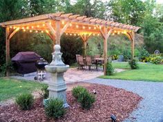 an outdoor gazebo with lights on it