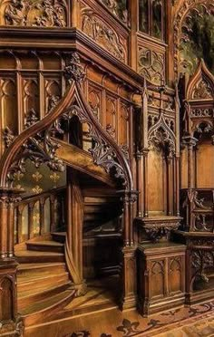 an ornate wooden staircase in a building