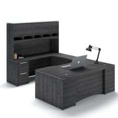 an office desk with a laptop on it