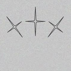 three crosses are drawn in the sky on a gray background