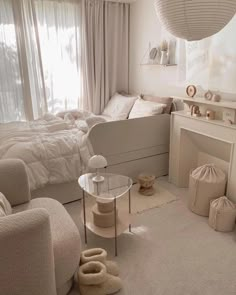 a bedroom with white furniture and pink sheets on the bed in front of a window