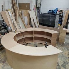 an unfinished circular table being constructed in a shop