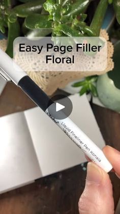 the easy page filler floral marker is shown in front of a potted plant