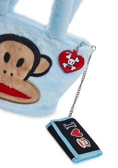 a blue purse with a monkey on it and a keychain attached to it