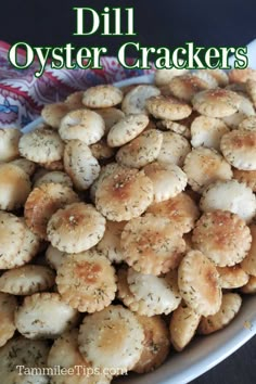 a white bowl filled with oyster crackers on top of a table