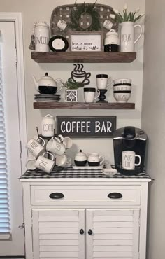 the coffee bar is decorated with white and black decor