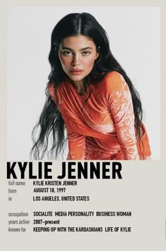 a woman with long black hair in an orange top is featured on the cover of magazine