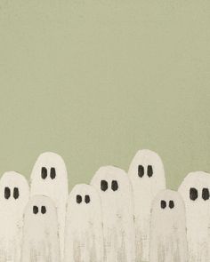 a group of white ghost standing next to each other