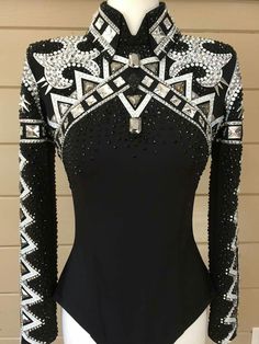 a black and white top with silver sequins on the neck, long sleeves