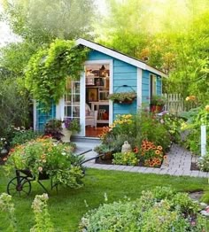 a garden shed with lots of flowers in it