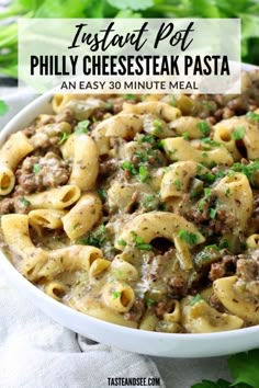 a white bowl filled with pasta covered in meat and cheese, next to parsley