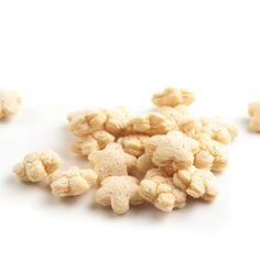 a pile of popcorn kernels on a white background