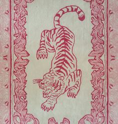 a red and white rug with a tiger on it