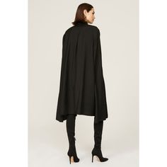 Black wool blend (54% Polyester, 44% Wool, 2% Elasthane). Shirt Dress. Long sleeves. Collar. Front button closure. 39" from shoulder to hemline. Imported. Formal A-line Outerwear For Fall, Formal A-line Fall Outerwear, Elegant Spring Cape For Workwear, Spring Fitted Workwear Cape, Fall Outerwear With Stand Collar For Evening, Spring Fitted Cape For Workwear, Fitted Black Cape For Work, Fall Evening Outerwear With Buttons, Evening Outerwear With Buttons For Fall