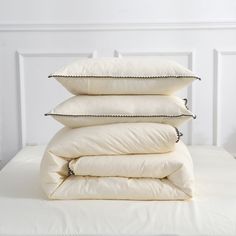 four pillows stacked on top of each other