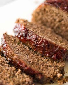 slices of meatloaf on a plate with ketchup