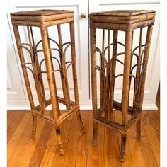 two wooden stools sitting on top of a hard wood floor next to each other