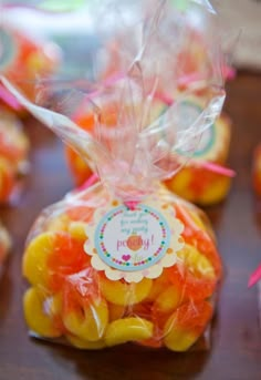 small bags filled with candy sitting on top of a table