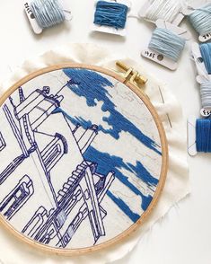 an embroidery project with blue and white designs