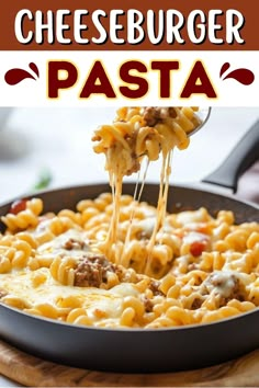 cheeseburger pasta in a skillet being lifted with a spatula