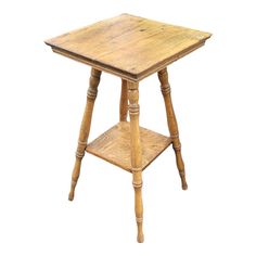 an old wooden table with two legs and a shelf on the top that is turned upside down