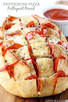 pepperoni pizza pull apart bread on a cutting board