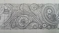 an intricately designed piece of paper with flowers and paisleys on the border, drawn in