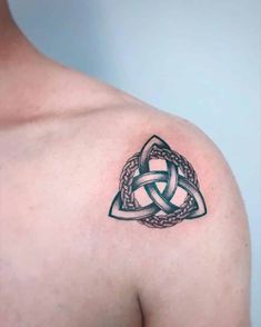 a celtic knot tattoo on the shoulder