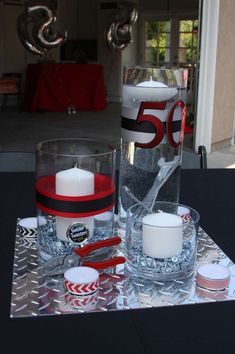 a table topped with two glasses and candles